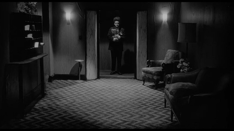 Henry Spencer standing in an elevator in Eraserhead