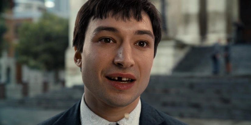 Barry Allen missing some teeth and looking ahead with a blank stare