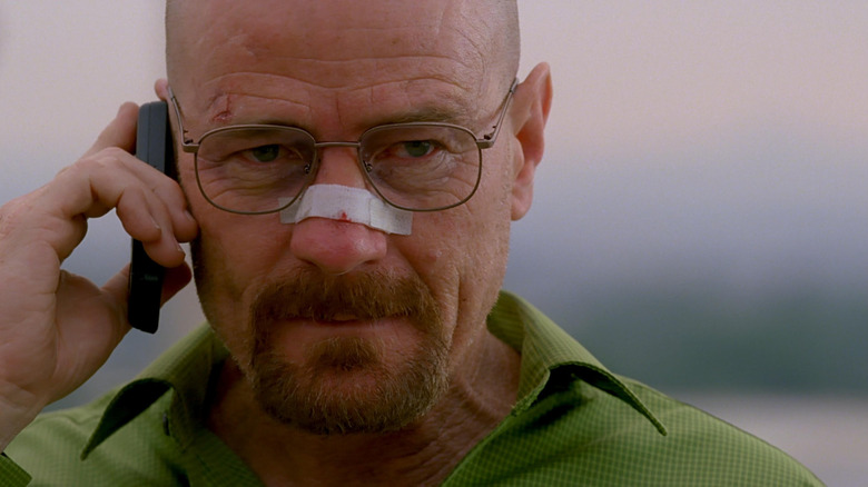 Bryan Cranston as Walter White with a bandaged nose on the phone in Breaking Bad