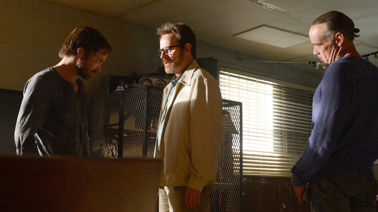 Jesse (Aaron Paul), Walt (Bryan Cranston), and Uncle Jack (Michael Bowen) standing together in Breaking Bad