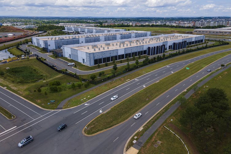 An overhead shot of a data center, which is made up of several blocklike concrete buildings