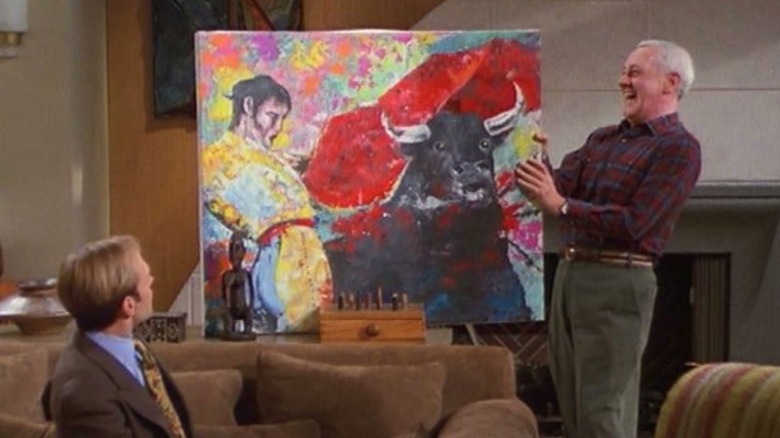 David Hyde Pierce as Niles Crane and John Mahoney as Martin Crane, observing a painting of a matador in Frasier.