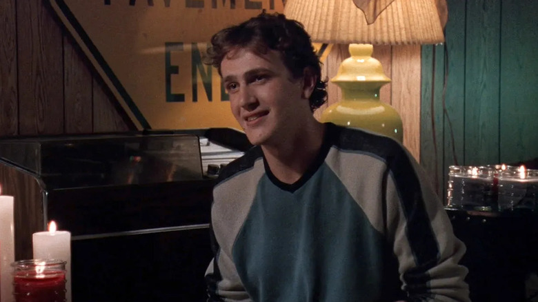 Nick smiling while seated