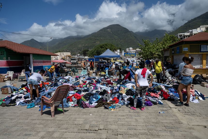 Clothes are offered for free at a square next to the Karting La Guaira complex in Caraballeda, La Guaira state, Venezuela, on June 27, 2026, following twin earthquakes.