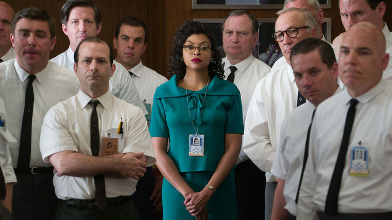 Katherine Goble (Taraji P. Henson) stands in the middle of a group of white scientists in Hidden Figures