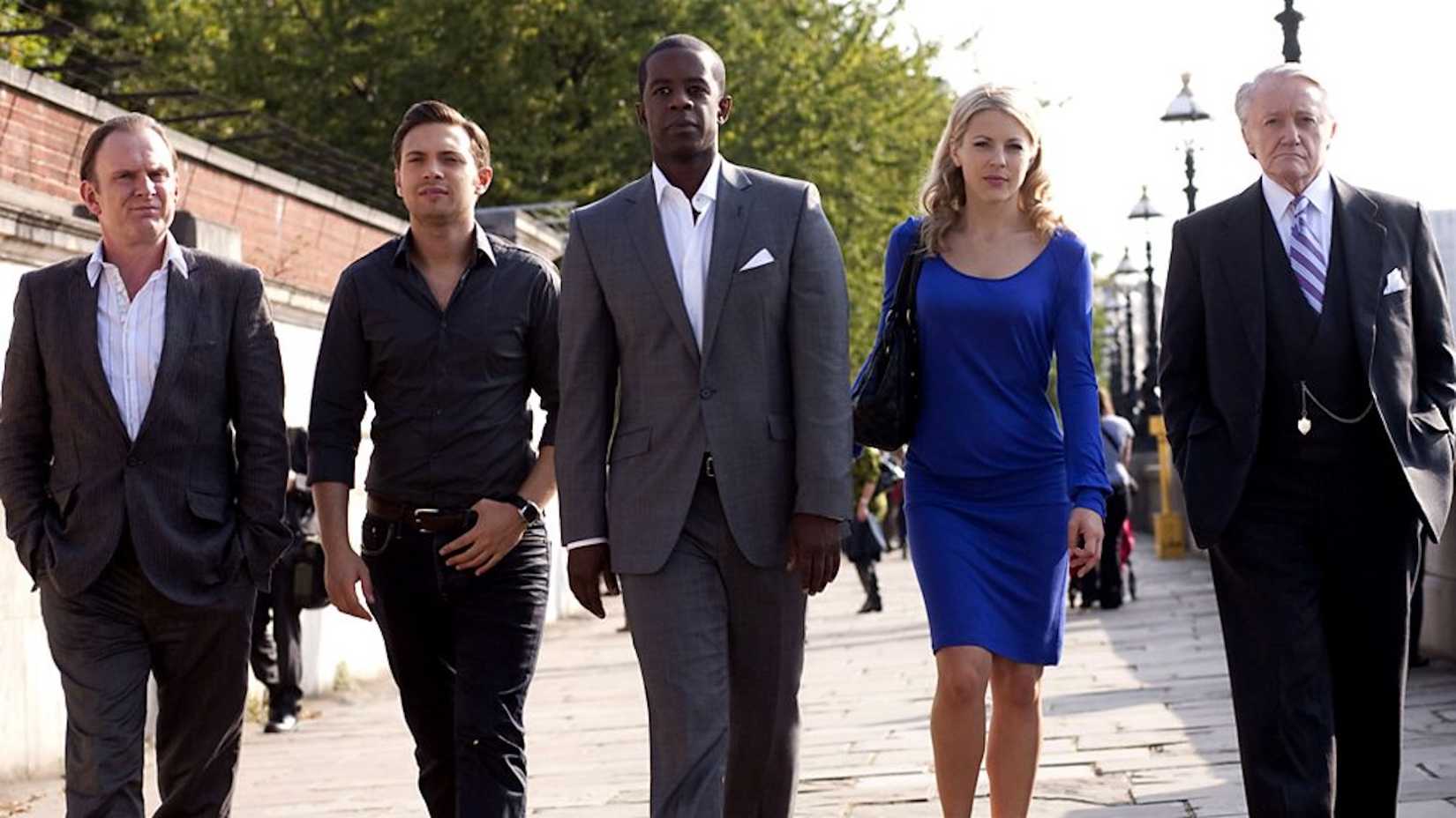 Image of main cast of characters from Hustle walking down a sidewalk together.