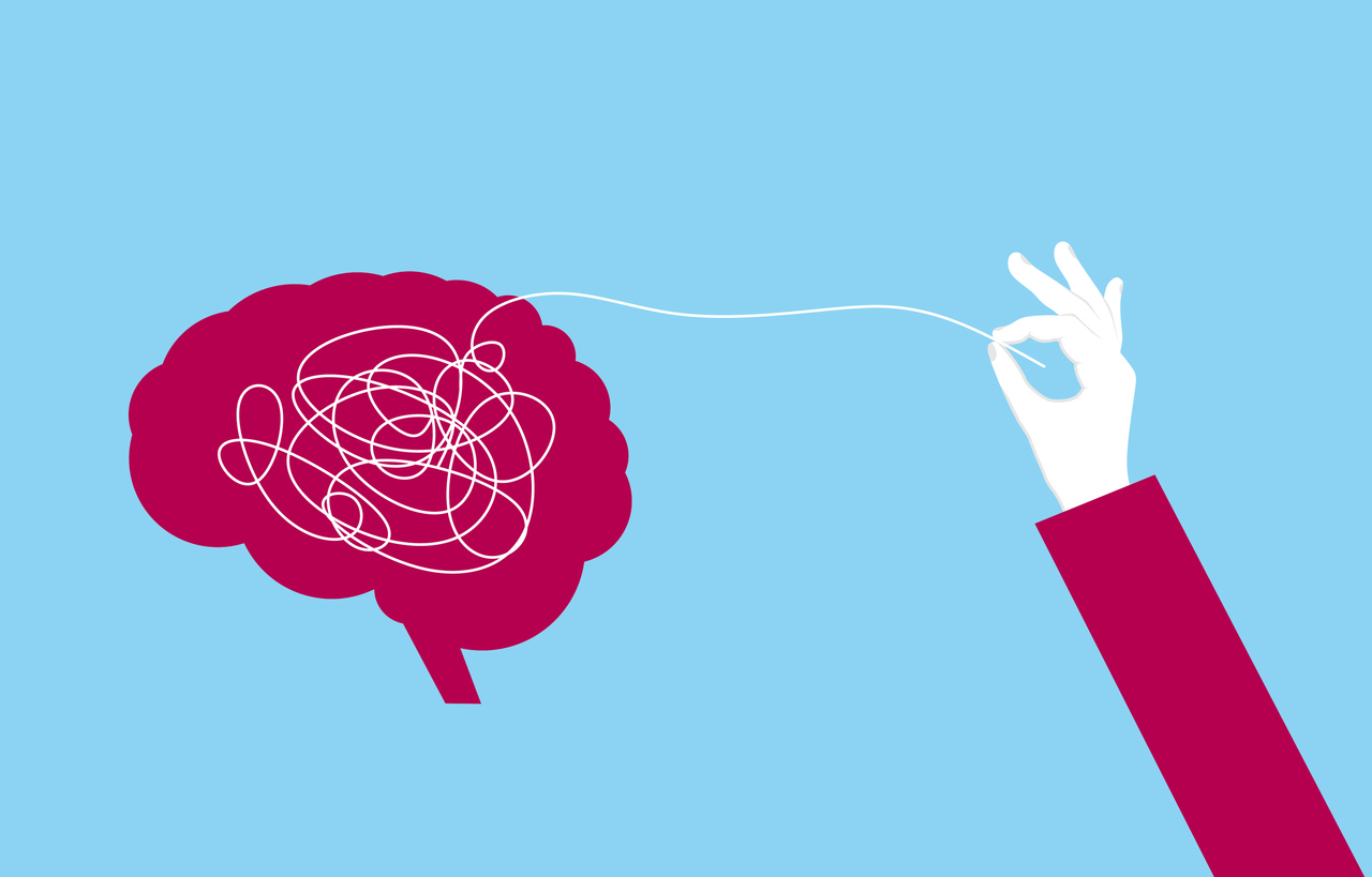 Hand pulling a thread from the brain to clear mental confusion and clarify thoughts