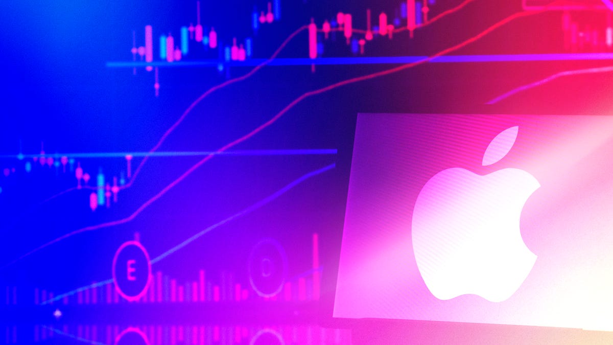 Apple Inc. logo displayed on a monitor with stock prices behind it showing financial ups and downs