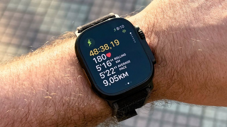 A man's wrist with an Apple Watch Ultra 2 during a workout