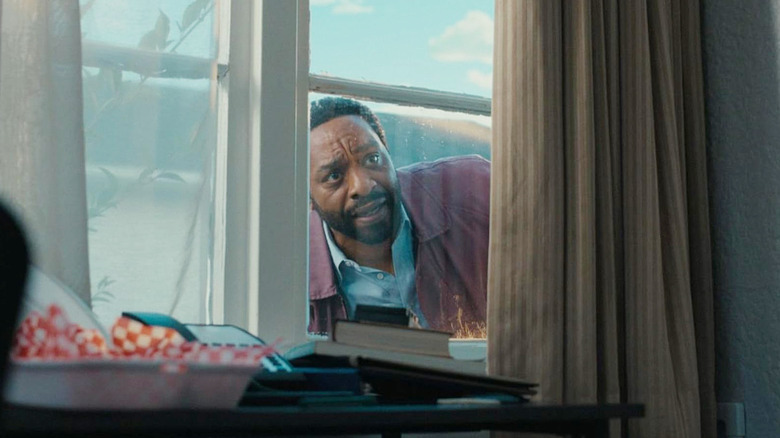Clark looking in through a window in Backrooms