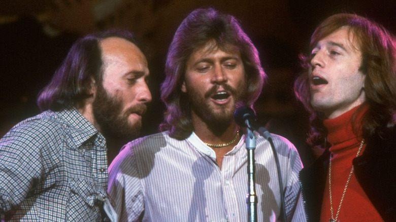 Bee Gees singing on stage