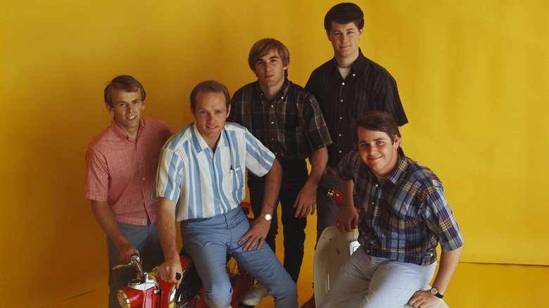The Beach Boys posing on mopeds in the early 1960s