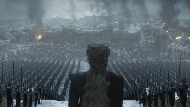 Daenerys looking out at a burnt King's Landing and her forces on Game of Thrones