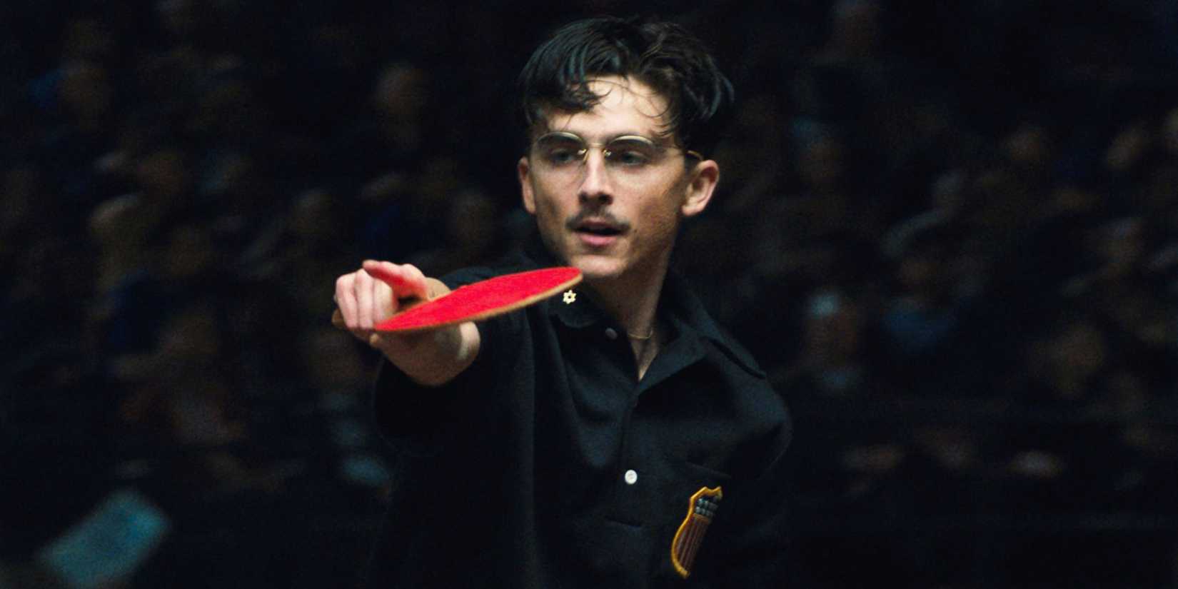 Timothée Chalamet as Marty Mauser playing a game of table tennis in Marty Supreme (2025)