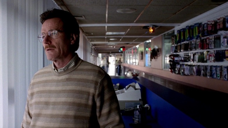 Bryan Cranston as Walter standing behind the car wash register in Breaking Bad