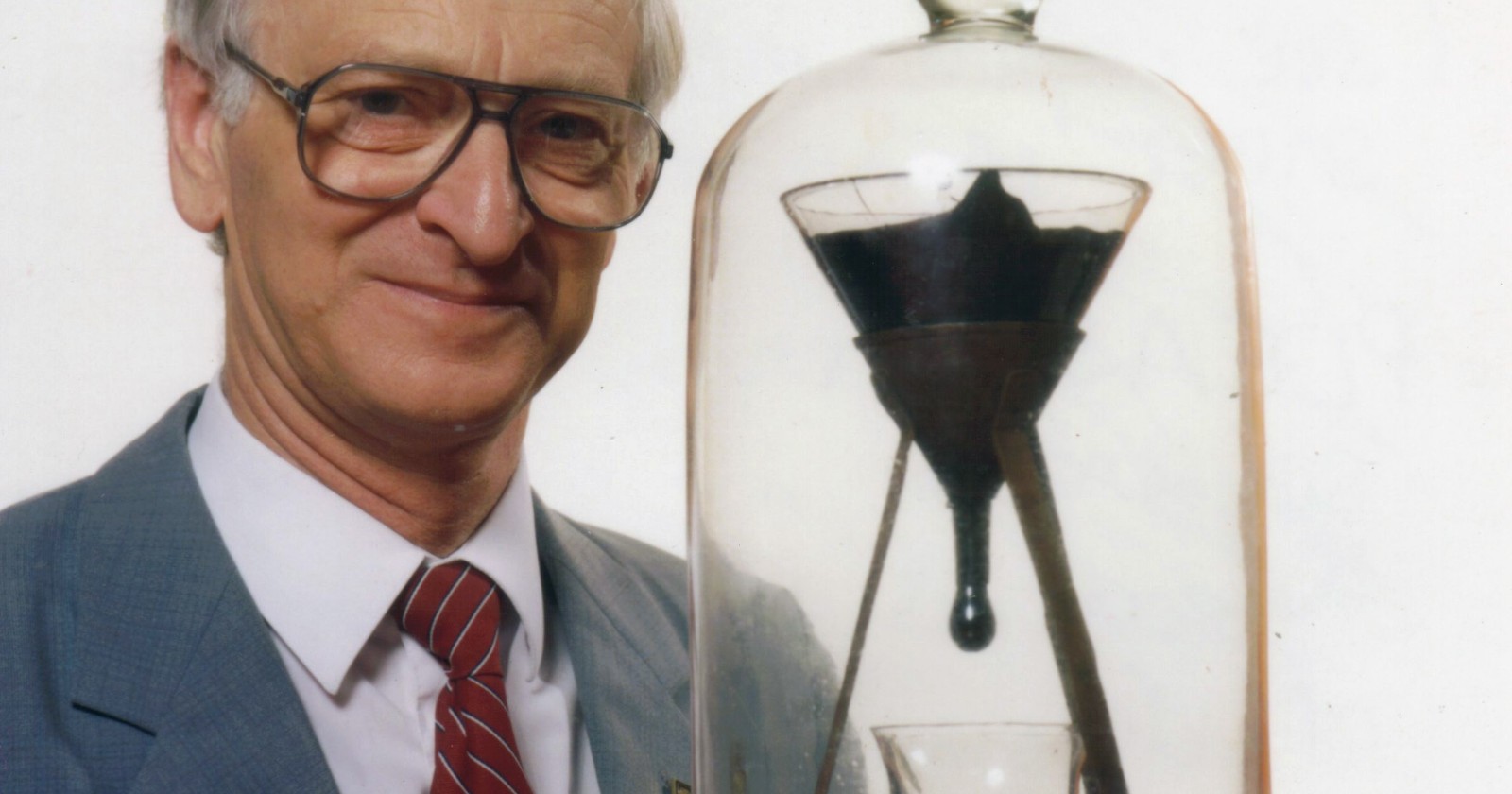 In 1927 a Brisbane physics professor melted a lump of tar and sealed it in a funnel, and almost a century later that tar, stiff enough to shatter under a hammer, has dripped only nine times