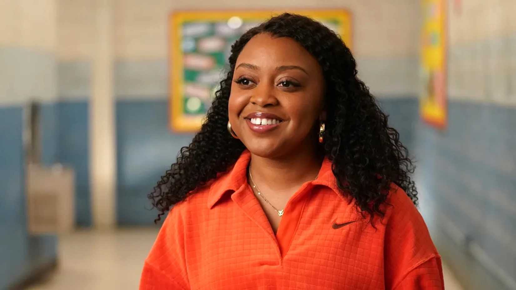 Quinta Brunson smiling as Janine Teagues in 'Abbott Elementary'