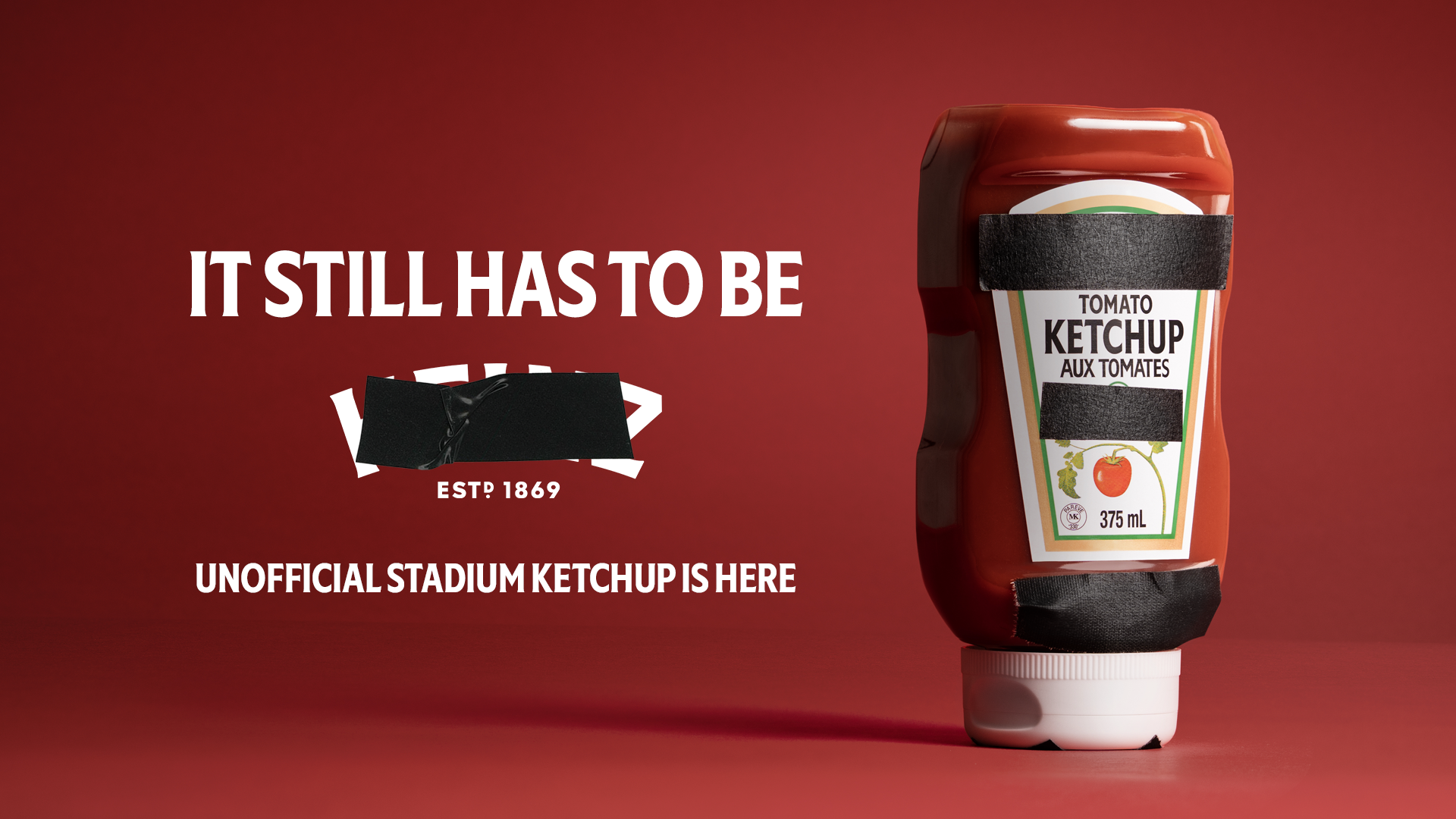 Heinz advert with blacked out branding of the word 'Heinz'. It reads 'It still has to be' Unofficial stadium ketchup is here