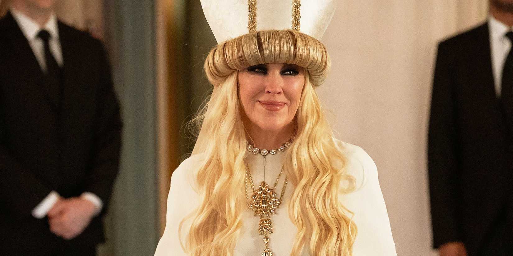 Catherine O'Hara as Moira Rose in a pope's outfit in Schitt's Creek.
