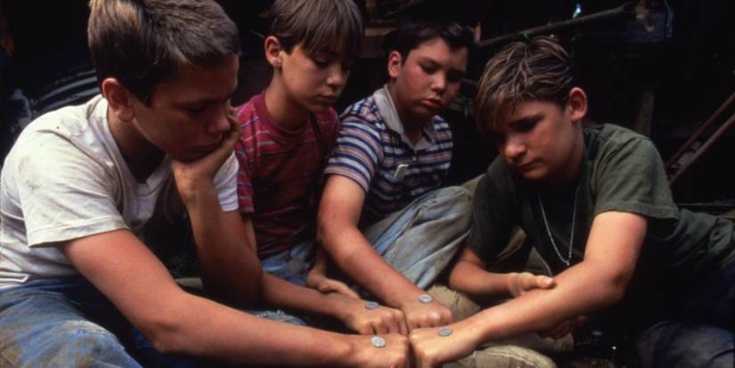 River Phoenix, Wil Wheaton, Jerry O'Connell, & Corey Feldman playing with coins in 'Stand by Me'