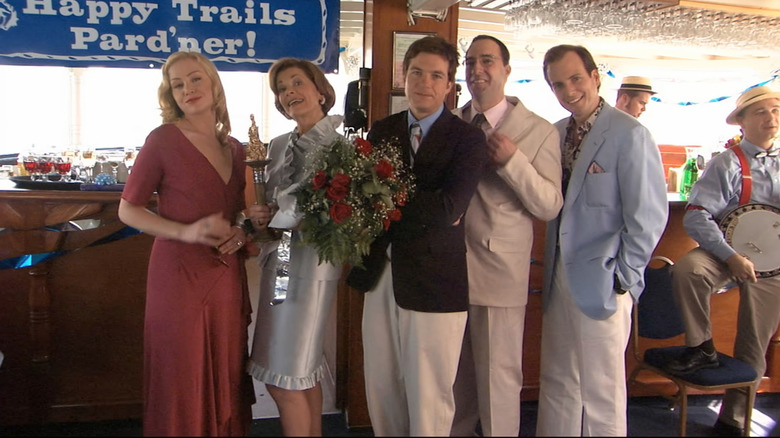 Lindsay, Michael, Buster, and Gob pose with their mother