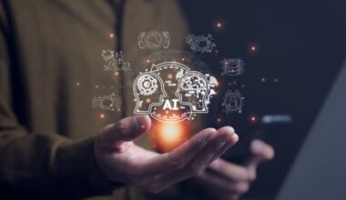 An artificial intelligence graphic hovers above an outstretched hand.