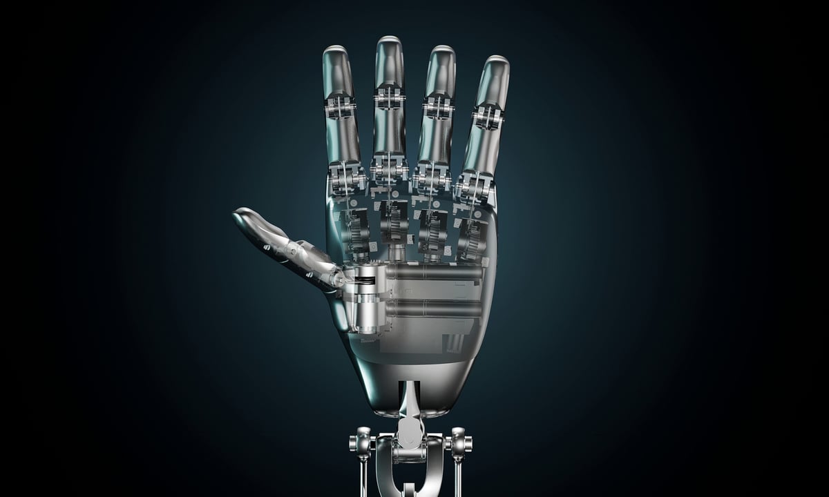 A Tesla robot hand is raised against a black background.