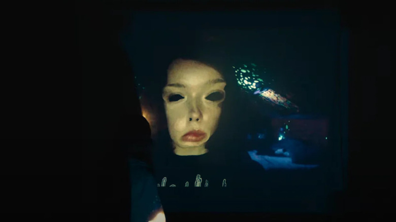 A twisted digital face of Casey in We're All Going to the World's Fair
