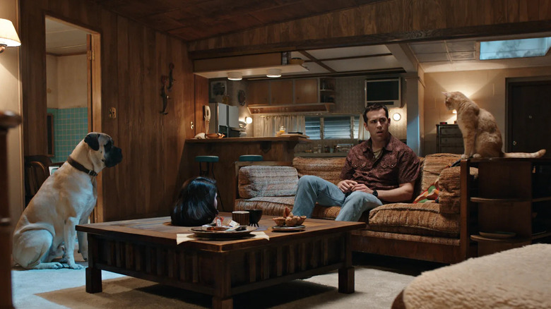 Jerry in his living room with his dog and cat in The Voices