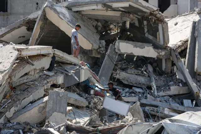 Residents inspect damage after last night's airstrikes by Israel on residential buildings on July 30, 2026