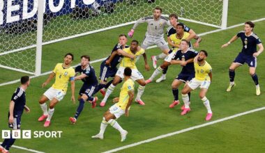 Brazil and Scotland players battle for position on a corner kick during the World Cup match at Miami Stadium