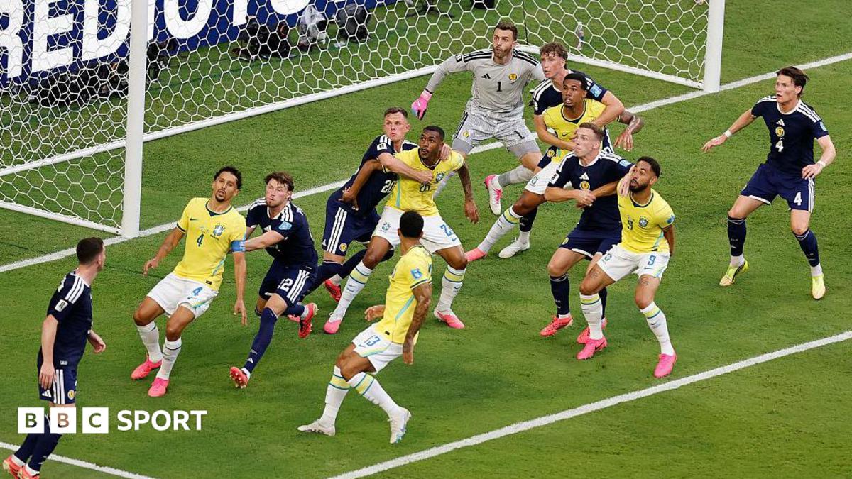 Brazil and Scotland players battle for position on a corner kick during the World Cup match at Miami Stadium