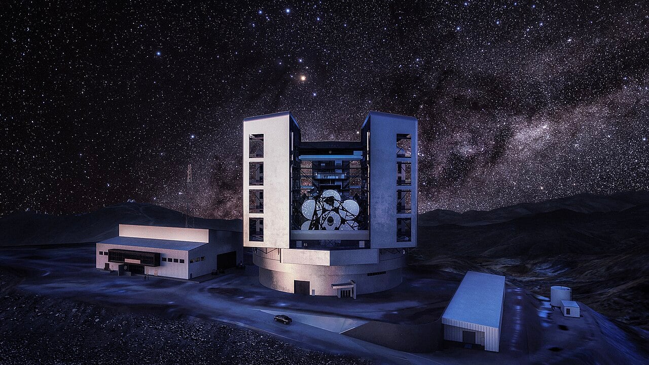 Nighttime exterior rendering of the Giant Magellan Telescope with support site buildings in the foreground at Las Campanas Observatory in the Chile Atacama Desert (Credit: Giant Magellan Telescope - GMTO Corporation)