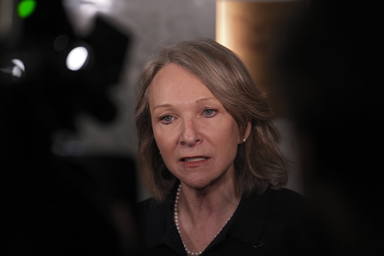 Sonia Bélanger dressed in all black addresses members of the press on March 25, 2026.