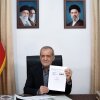 In this photo provided by the Islamic Republic News Agency (IRNA), Iranian President Masoud Pezeshkian displays a memorandum of understanding signed with U.S. President Trump aimed at ending the war and launching negotiations on a broader agreement, in Tehran, Iran, early Thursday.
