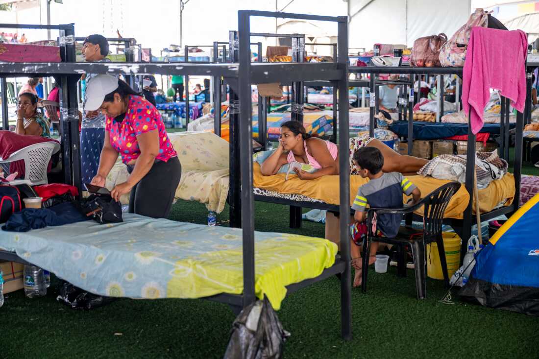 People displaced by the June 24 earthquakes rest on bunk beds inside a temporary shelter set up at the Jose Maria Vargas sports complex in Catia la Mar, La Guaira state, Venezuela, on July 6. 