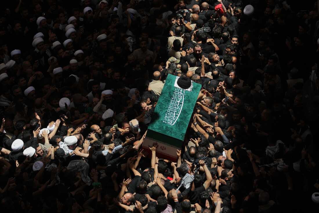 The coffin of the late Iranian Supreme Leader Ayatollah Ali Khamenei is carried by mourners to the Imam Ali Shrine in Najaf, Iraq, Wednesday, July 8, 2026.