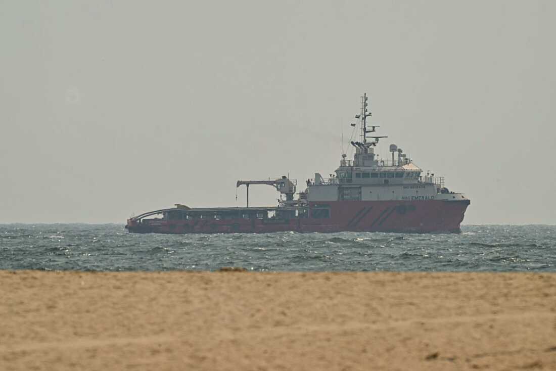 A ship sails off the coast of Ajman, United Arab Emirates, on Friday.