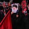 A man holds a poster of the late Iranian Supreme Leader Ayatollah Ali Khamenei in a gathering commemorating him at a square in Tehran on Saturday.