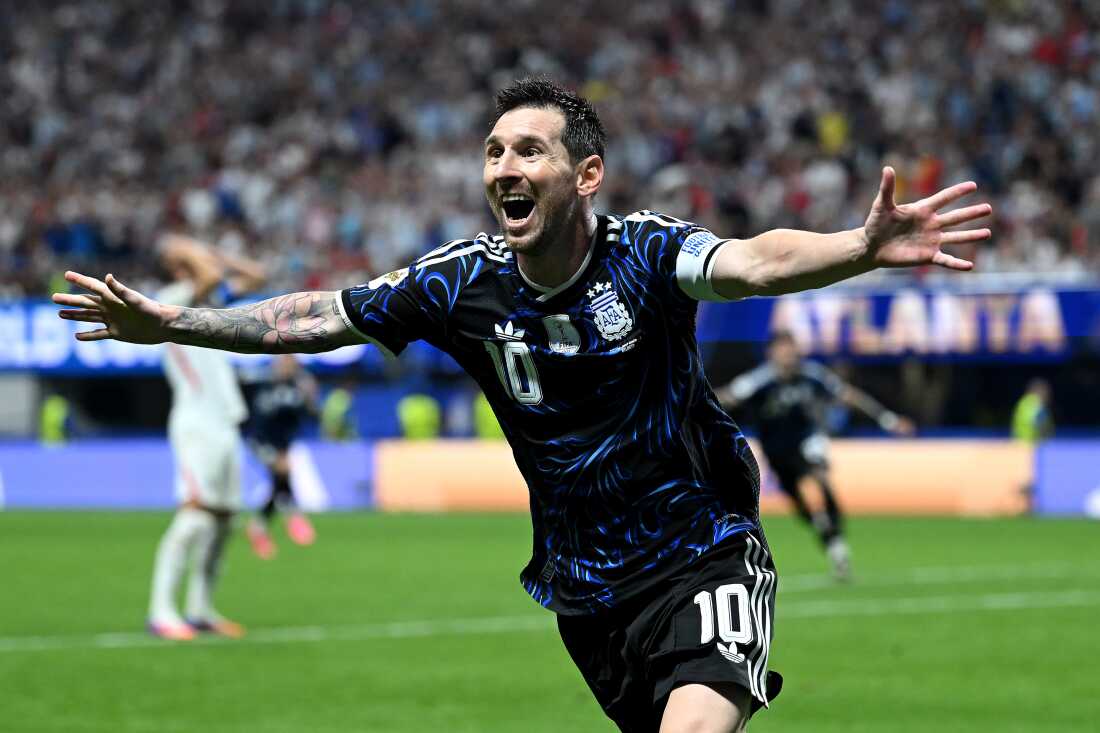 Argentina's Lionel Messi celebrates the team's second goal by Lautaro Martínez during their World Cup semifinal against England on Wednesday in Atlanta. Argentina defeated the English 2-1 to advance to Sunday's final against Spain.