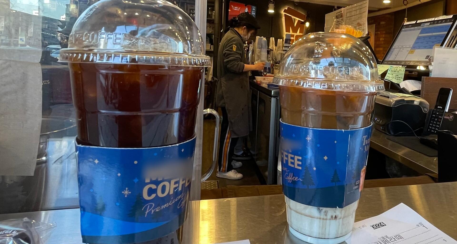 A coffee cup made of single-use plastic is pictured in use at a cafe in Seoul, Jan. 6, 2022. Yonhap