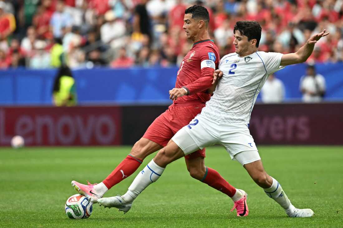 Portugal's Cristiano Ronaldo (left) fights for the ball with Uzbekistan's Abdukodir Khusanov during the World Cup match between Portugal and Uzbekistan in Houston on June 23. Last year, Khusanov became the first Uzbek player to compete in the Premier League.