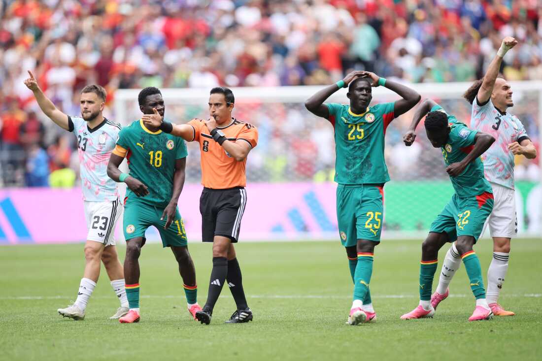 Players react to FIFA referee Said Martinez as a penalty kick is awarded to Belgium after the VAR review during the World Cup round Of 32 match between Belgium and Senegal in Seattle on July 1.