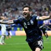 Argentina's Lionel Messi celebrates the team's second goal by Lautaro Martínez during their World Cup semifinal against England on Wednesday in Atlanta. Argentina defeated the English 2-1 to advance to Sunday's final against Spain.