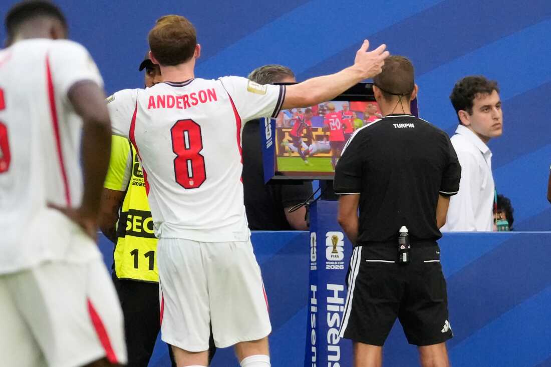 FIFA Referee Clement Turpin watches a VAR replay screen to check for a possible penalty during the World Cup quarterfinal soccer match between Norway and England in Miami Gardens, Fla., Saturday, July 11, 2026.