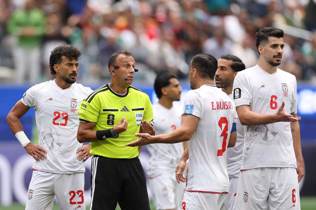 Ehsan Hajisafi #3 of Iran protests to Referee Dario Herrera after a VAR review disallowed an Iranian goal during a World Cup match against Belgium on June 21, 2026 in Inglewood, Calif.