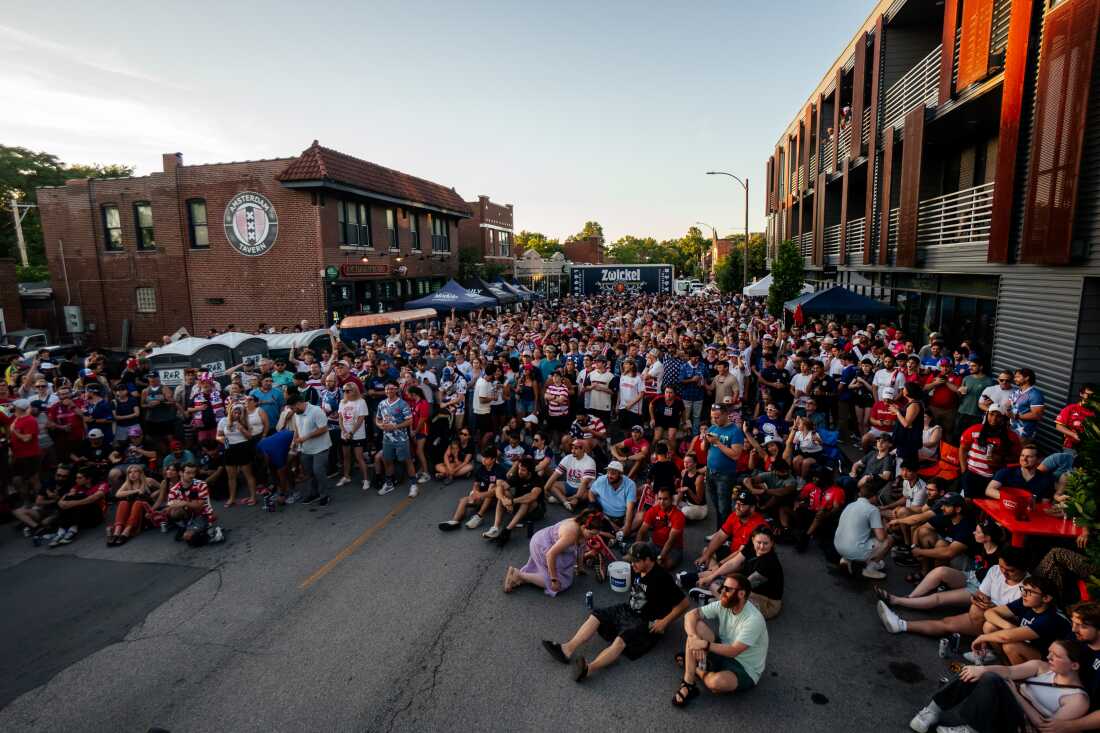 U.S. fans gather to watch the team rout Paraguay 4-1 during the FIFA World Cup on Friday, June 12, outside Amsterdam Tavern in south St. Louis.