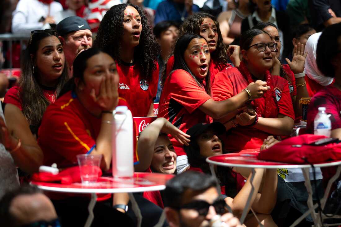 Soccer fans rooting for Egypt, including Mennatalla Namatalla, center, who was born in Cairo, react to the game's suspense during the FIFA World Cup match against Belgium at a watch party on Monday, June 15, at Occidental Square in Seattle’s Pioneer Square neighborhood.