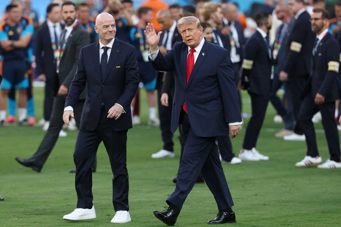 FIFA President Gianni Infantino (L) and President Donald Trump arrive for the final ceremony after the 2026 World Cup final won by Spain over Argentina in East Rutherford, N.J. on July 19, 2026.