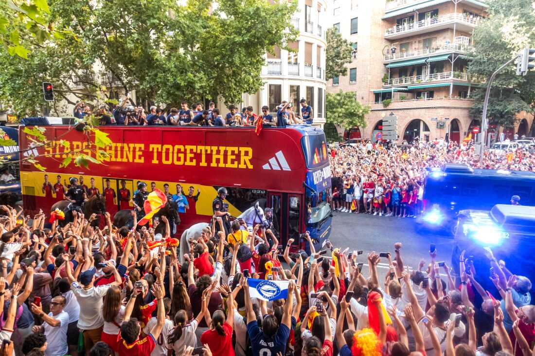 Players from Spain's national soccer team celebrate atop a bus as it travels through crowded streets in Madrid, Monday, July 20, 2026, after Spain defeated Argentina in the World Cup final in East Rutherford, N.J., near New York.